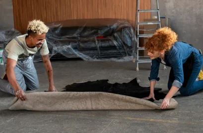 couple-handling-carpet-together-their-new-home_23-2149086840